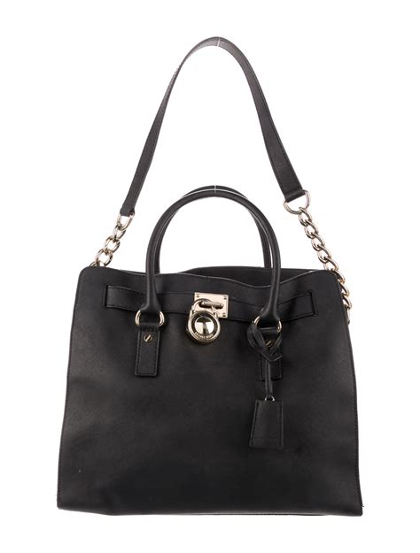 brincos michael kors|Michael Kors leather tote.